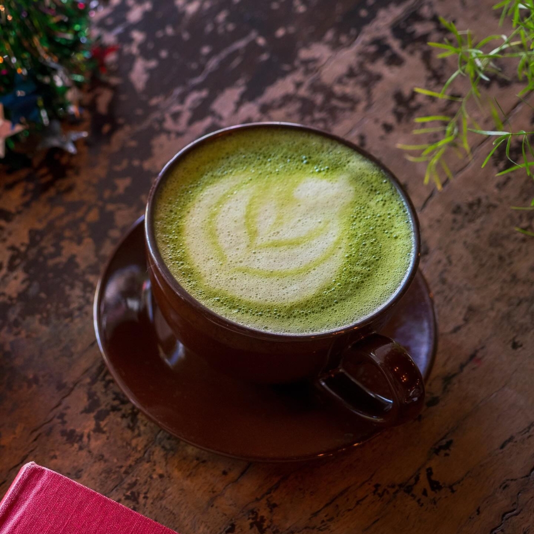 Hot matcha on a wooden table