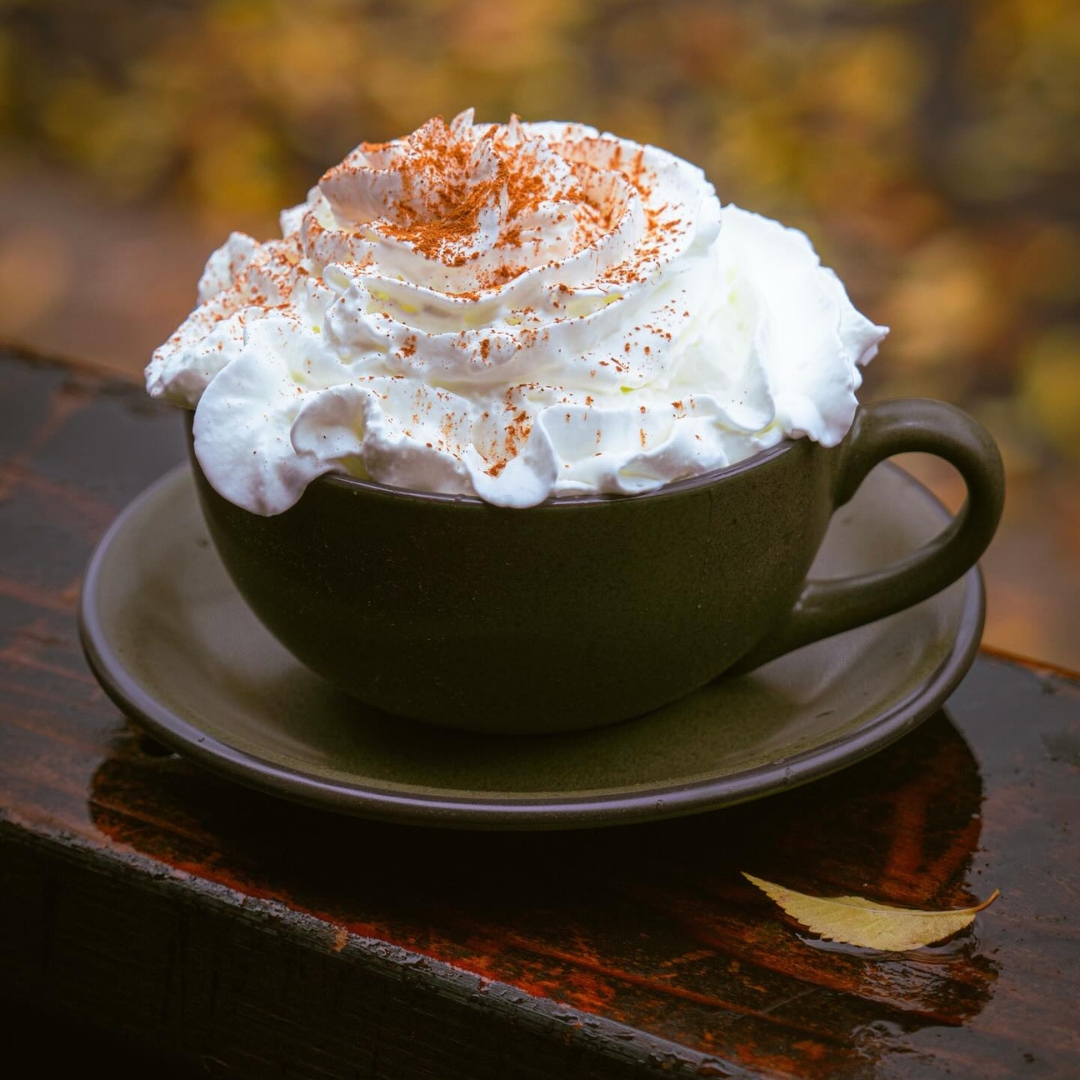 A white hot chocolate with extra whip cream